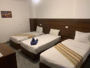 Cama o camas de una habitación en Z Pyramids Inn