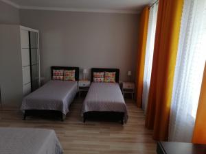 En eller flere senge i et værelse på Mieszkanie Sławięcice