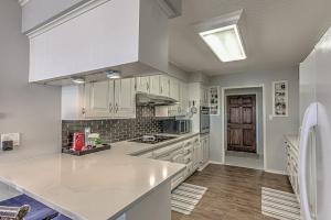 a kitchen with white cabinets and a counter top at Waterfront Family Home for 12 w Deck & Lake Views in Kingsland +53 photos