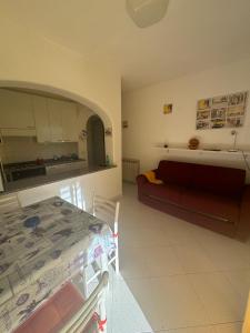 a living room with a couch and a table at Villa Antonio in Forio d'Ischia