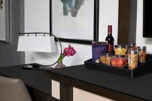 a black table with a bottle of wine and snacks at The Ritz-Carlton Atlanta in Atlanta