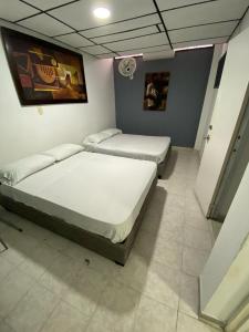 Ένα ή περισσότερα κρεβάτια σε δωμάτιο στο Casa Vía Italia