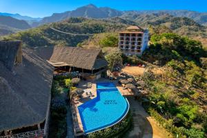 an aerial view of a resort with a swimming pool at River Park Hotel in Puerto Vallarta