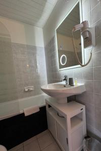 Koupelna v ubytování Hotel Capricorne