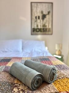 a bed with two pillows on top of it at Apartament Rosalia in Srebrna Góra