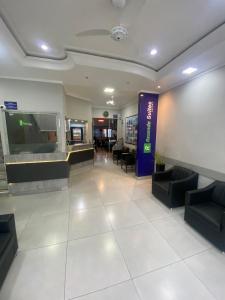 a lobby of a hospital with a waiting room at Rezende Suítes in Balneário Camboriú