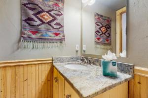 a bathroom with a sink and a mirror at Harris House in Breckenridge +37 photos
