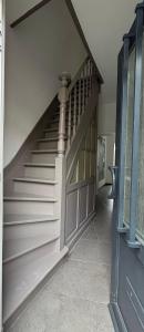 a staircase in a house with a stair case at gezellige woning met tuin centrum Leuven in Leuven
