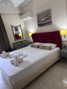 Postel nebo postele na pokoji v ubytování Paradise Hotel