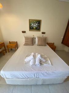 Postel nebo postele na pokoji v ubytování Paradise Hotel