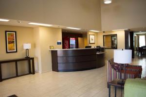 a lobby with a waiting area in a hospital at Cotulla Express Inn in Cotulla