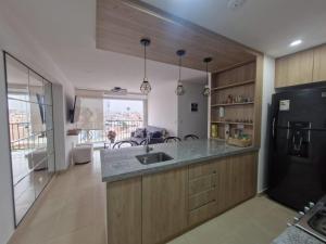 O bucătărie sau chicinetă la Departamento a un paso de playa Pulpos y Arica +16 fotografii