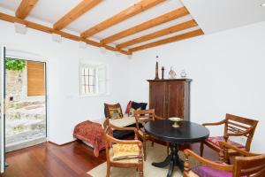 a dining room with a table and chairs at Luxury Villa In the Old Town with Stunning Views in Dubrovnik