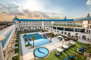 an overhead view of a large building with a swimming pool at Kempinski Palace Cairo in Cairo