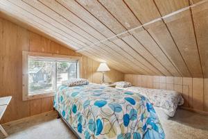 a bedroom with a bed and a window in a room at Moose Lodge in McCall +23 photos