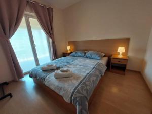 Postel nebo postele na pokoji v ubytování Apartments Tea