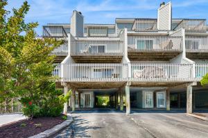 a large building with a deck on top of it at Indian Harbor Villas -- 31 Indian Harbor in Bethany Beach