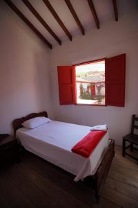 Postelja oz. postelje v sobi nastanitve La Oculta Hostal
