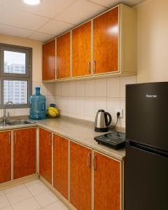 Kuchyň nebo kuchyňský kout v ubytování The Mini Homes Dorm Near Metro station + 7 fotografií