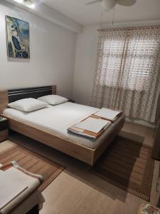 a bedroom with a bed and a window at Apartmani Marijela in Orebić +32 photos