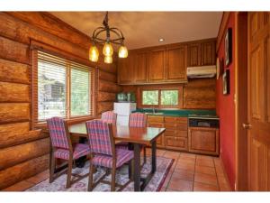 a kitchen with a wooden table and chairs at Fiore Shima - Vacation STAY 25660v in Shima