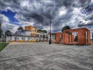 a group of buildings in a parking lot at Sandacz Otmuchów in Otmuchów