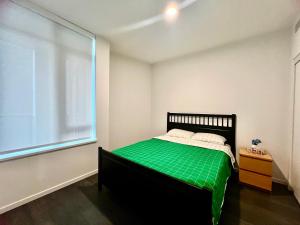 Ένα ή περισσότερα κρεβάτια σε δωμάτιο στο Best location &comfortable room1B &1B Richmond center +6 φωτογραφίες