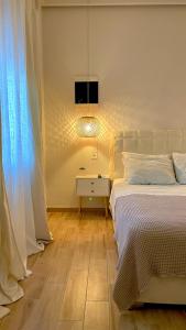 Postel nebo postele na pokoji v ubytování Elia Room & Garden
