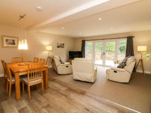 a living room with a table and chairs and a dining room at Spicery in Exeter