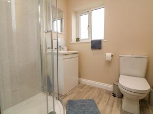 a bathroom with a toilet and a glass shower at Spicery in Exeter +26 photos