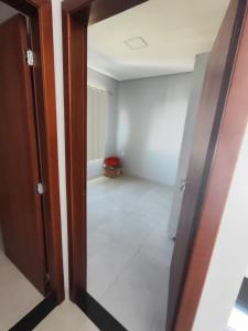 an open door to a room with a hallway at Casa para período Bahia Farm Show valor negociável in Luis Eduardo Magalhaes