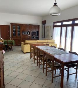a living room with a table and a couch at il Quadrifoglio camere in stile vintage in Cesena