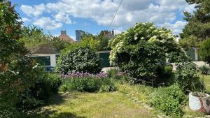a garden with plants and flowers in a yard at MILET style and spacy 2 room apartment with AC in Bratislava Nivy in Nivy