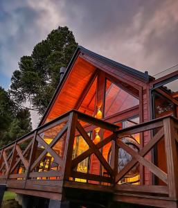 a glass house with a large window on top of it at Rancho Texel Chalé de Luxo in Rancho Queimado +72 photos
