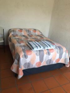 a bed with pillows on it in a room at Casa Fragatas in Ixtapa in Ixtapa +6 photos