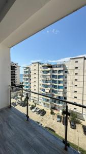 a balcony with a view of some buildings at 9apartaments Shengjin in Shëngjin
