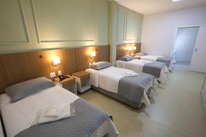 Katil atau katil-katil dalam bilik di Santorini Hotel Ltda