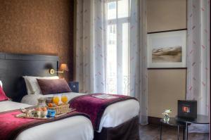 Postel nebo postele na pokoji v ubytování Best Western Plus Nice Cosy Hotel