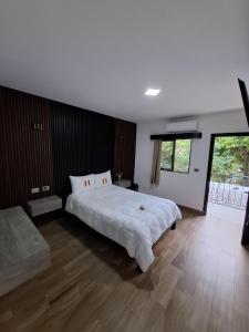 Postel nebo postele na pokoji v ubytování Hotel Sevilla Palenque