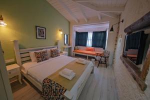 a bedroom with a large bed in a room at MorAnka Alaçatı in Alacati +47 photos