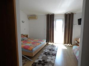 Posteľ alebo postele v izbe v ubytovaní Judith Apartment