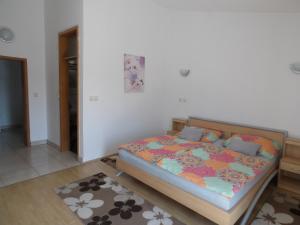 Posteľ alebo postele v izbe v ubytovaní Judith Apartment
