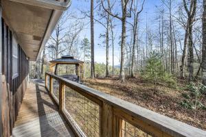 a porch of a house with a gazebo at Grassy Paradise by Avada Properties in Sevierville
