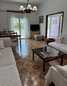 a living room with a couch and a coffee table at Lemon tree's house in Kalavárda