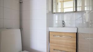 a bathroom with a sink and a toilet at Spacious Apartment for 6 in Espoo +10 photos