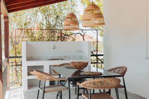 a dining room with a table and chairs at Nikolaidis Villa Family Friendly in Nea Kallikrateia