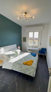 a bedroom with a large bed and a window at Lorenzo s House Nearby Leaning Tower Free Parking in Pisa