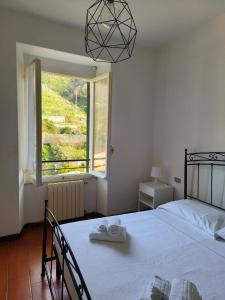 A bed or beds in a room at Camere Toni