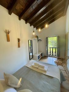 a bedroom with a large bed in a room at Casa Pepina in Pedroso +29 photos