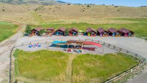 an overhead view of a campground in a field at Emigrant Cabins in Emigrant
